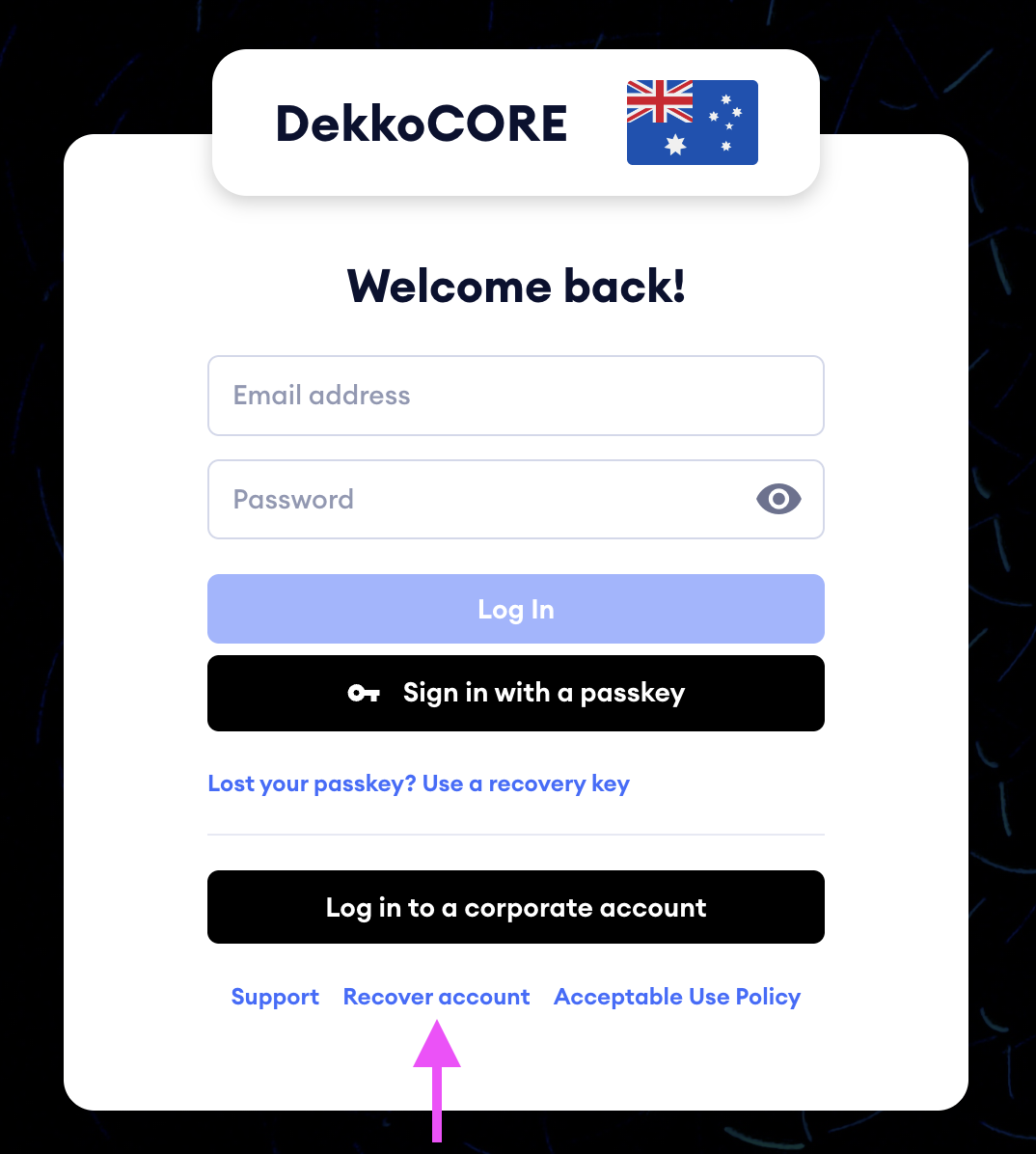 Login page for DekkoCORE with a pink arrow pointing to the "Recover account" link beneath the Log In buttons.