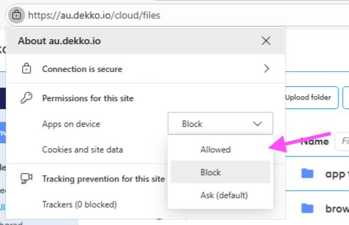 Browser site-permissions popup for au.dekko.io showing "Apps on device" set to Block, with the Allowed option highlighted by an arrow.