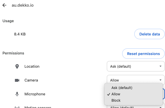 Site settings for au.dekko.io showing Camera set to Allow, with the Microphone dropdown open listing Ask (default), Allow, and Block.