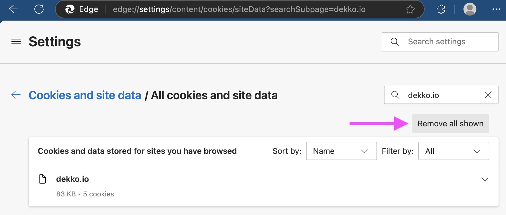 Edge Settings page showing cookies and site data filtered to dekko.io, with a pink arrow pointing to the "Remove all shown" button.